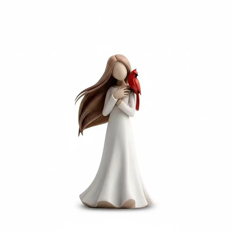 Figurine Holding Bird Homeandso