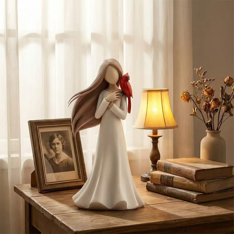 Figurine Holding Bird Homeandso