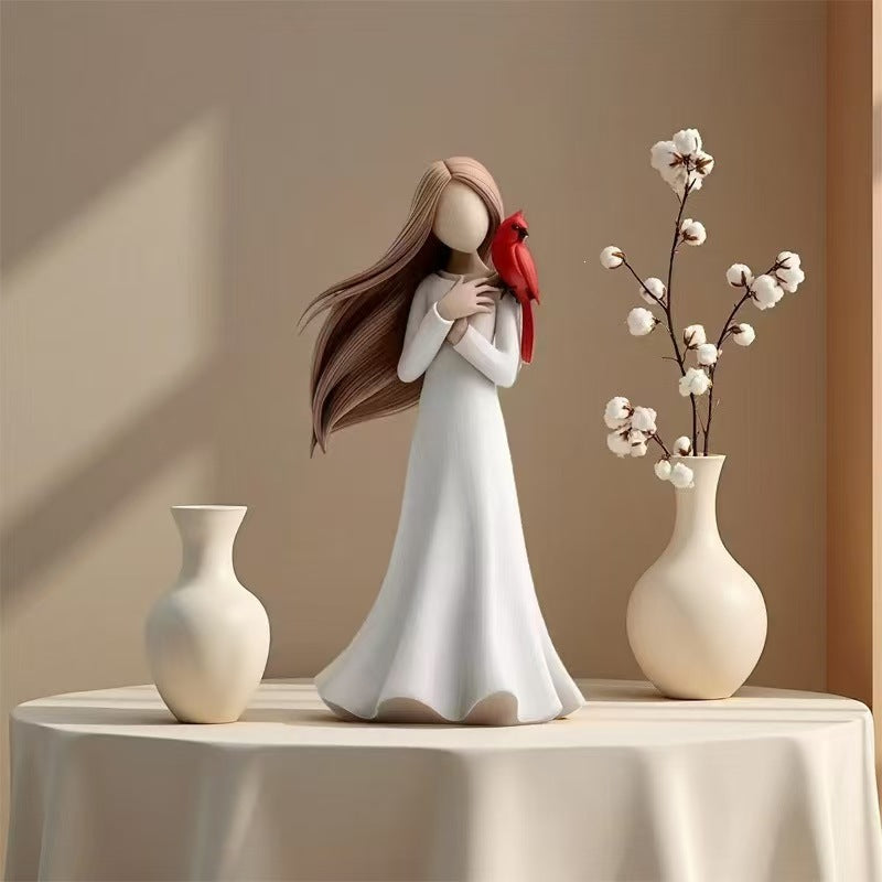 Figurine Holding Bird Homeandso