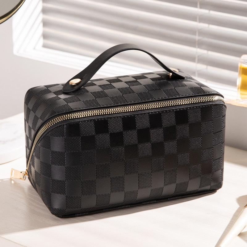 Cosmetic bag in check pattern made of PU leather with carrying handle
