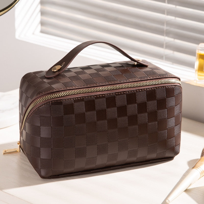 Cosmetic bag in check pattern made of PU leather with carrying handle
