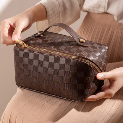 Cosmetic bag in check pattern made of PU leather with carrying handle