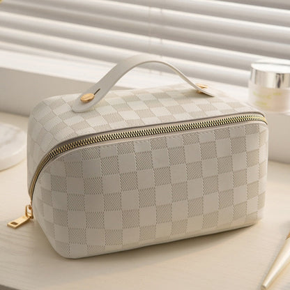 Cosmetic bag in check pattern made of PU leather with carrying handle